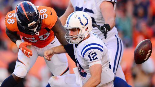 DENVER, CO - SEPTEMBER 18: Outside linebacker Von Miller #58 of the Denver Broncos strips the ball from quarterback Andrew Luck #12 of the Indianapolis Colts in the fourth quarter of the game at Sports Authority Field at Mile High on September 18, 2016 in Denver, Colorado. (Photo by Dustin Bradford/Getty Images)