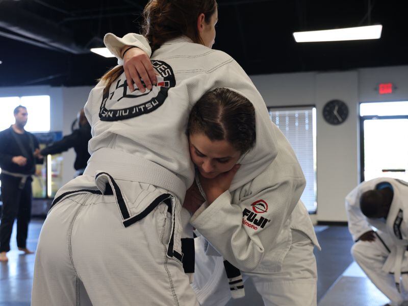 10/19/2021 -Marietta, Georgia: Officer Stacy Fowler trains at Borges Brazilian Jiu Jitsu gym in an effort to reduce use-of-force injuries. The Marietta police department now mandates weekly training sessions. (Tyson Horne / Tyson.Horne@ajc.com)