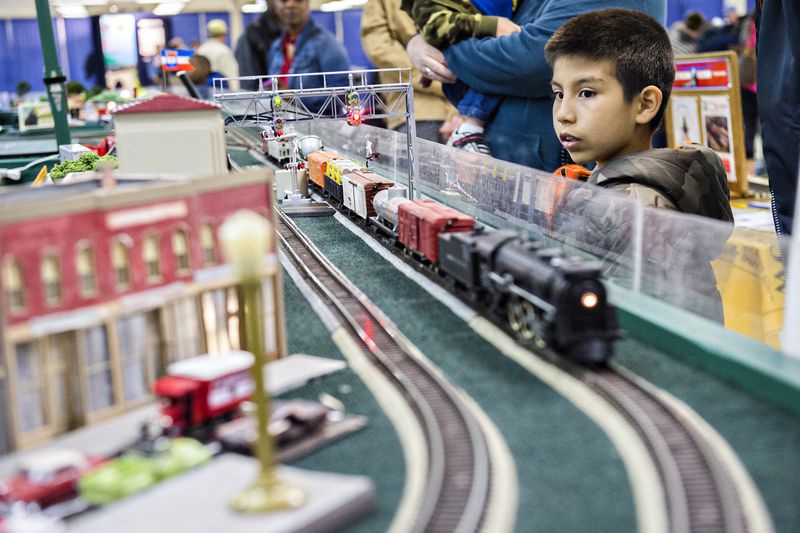 January 16, 2016 Norcross - Wyatt Boudway (right) watches a train pass by during the 50th annual Atlanta Model Train And Railroadiana Show And Sale at the North Atlanta Trade Center in Norcross on Saturday, January 16, 2016. JONATHAN PHILLIPS / SPECIAL
