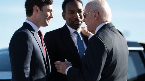 FILE — President Joe Biden, right, greets Atlanta Mayor Andre Dickens, center, and Sen. Jon Ossoff (D-Ga.) as he arrives at the Hartsfield-Jackson Atlanta International Airport in Atlanta, Jan. 15, 2023. Atlanta, Chicago and New York are finalists to host the 2024 Democratic Convention, and local Democrats are eager to bend Biden’s ear to host his formal nomination event. (Oliver Contreras/The New York Times)