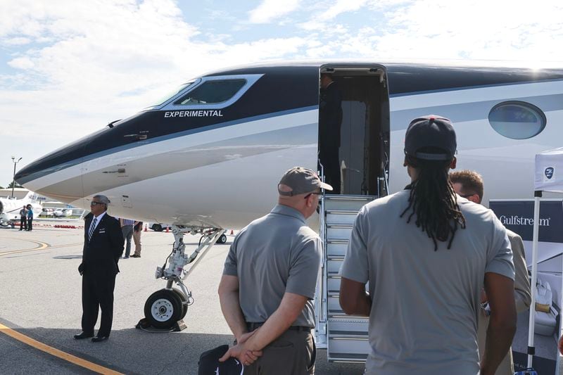 People wait in line to view the interior of the Gulfstream G700 private jet on display at McCollum Field in Kennesaw on Wednesday, September 6, 2023. (Natrice Miller/ Natrice.miller@ajc.com)