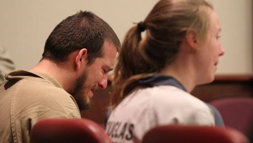 Jose “Joe” Torres and Kayla Norton weep during their sentencing engaging in street crime terrorism on Feb. 27. (HENRY TAYLOR / HENRY.TAYLOR@AJC.COM)