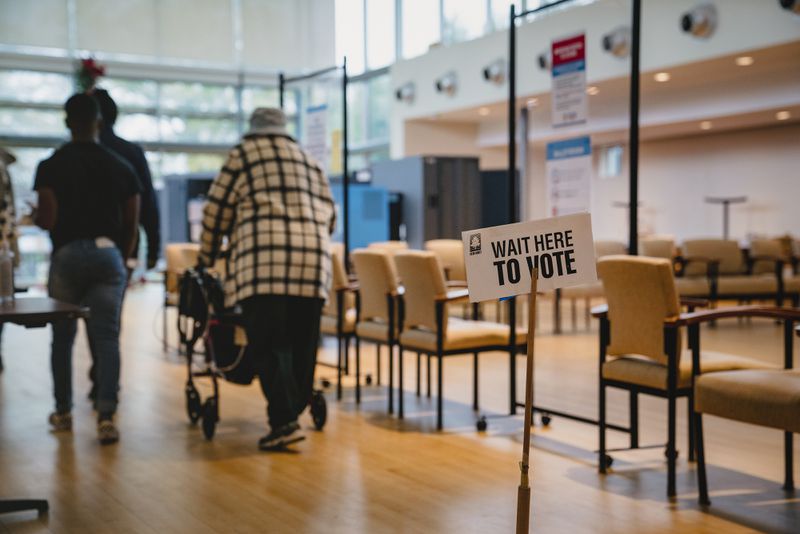 While nine Republican-led states have recently quit the voter accuracy organization called ERIC, Georgia election officials say the numbers tell the story: It’s working. Pictured: Voters wait to cast their ballots at a polling location in Atlanta on Tuesday, Dec. 6, 2022. (Nicole Craine/The New York Times)