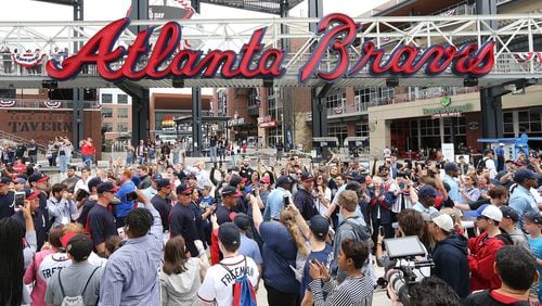 Freddie Freeman (center) and the Braves participate in the 'Brave Walk', a parade by players and coaches down Battery Way and into the Chop House gate prior to Thursday's season opener against the Phillies at SunTrust Park.