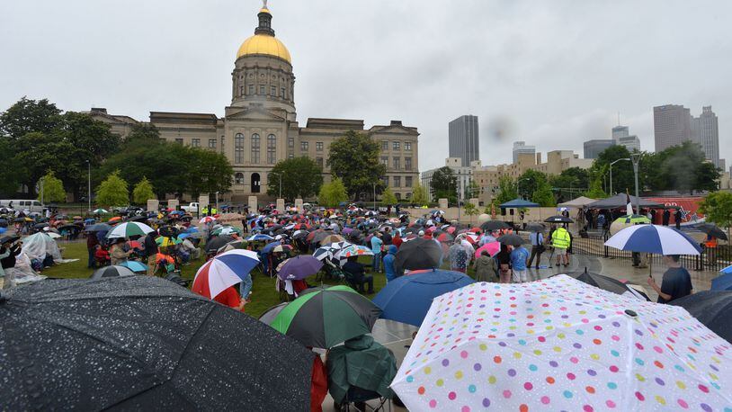Less than a month after Gov. Nathan Deal vetoed a controversial “religious liberty” bill, several hundred people defied the rain to attend the “We Stand with God Pro-Family Rally” on April 22 in Liberty Plaza, across from the Georgia Capitol, to support such legislation. HYOSUB SHIN / HSHIN@AJC.COM