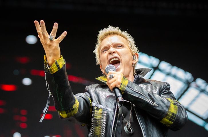Atlanta, Ga: After a torrential downpour, Billy Idol came through and wowed the crowd with hits. The 68 year old didn't miss a beat despite wireless complications at the beginning of his set. Photo taken Sunday May 5, 2024 at Central Park, Old 4th Ward. (RYAN FLEISHER FOR THE ATLANTA JOURNAL-CONSTITUTION)