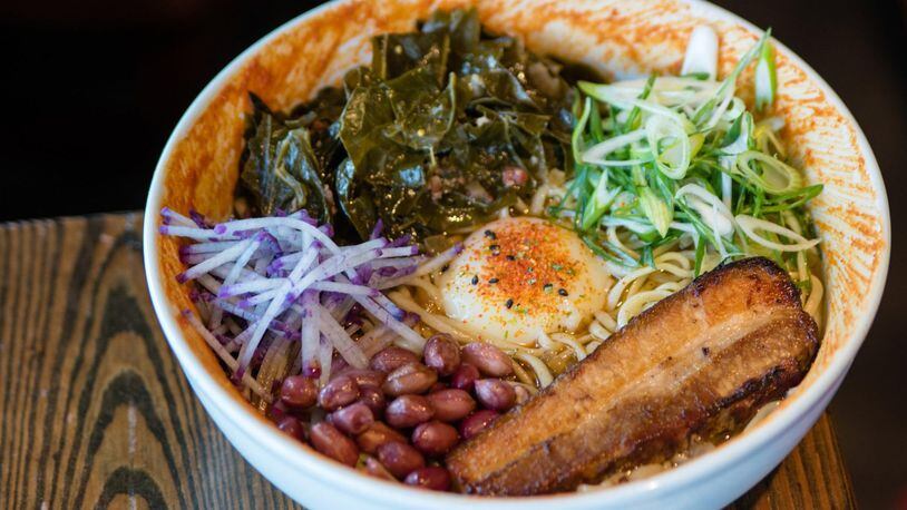 The beautiful Southern Ramen at BoccaLupo is packed with eye-popping colors and rimmed with Hozon, a spicy condiment based on miso. CONTRIBUTED BY HENRI HOLLIS