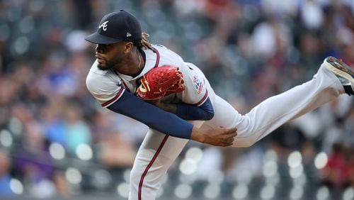 Atlanta Braves starting pitcher Touki Toussaint works against the Colorado Rockies during the first inning of a baseball game Thursday, Sept. 2, 2021, in Denver. (AP Photo/David Zalubowski)