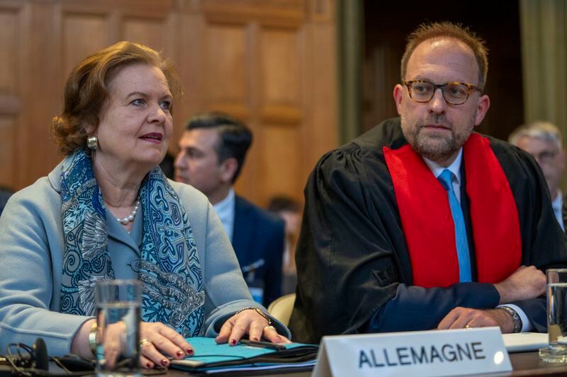 Tania von Uslar-Gleichen, Germany's legal adviser and Director-General for Legal Affairs of the German Foreign Ministry, left, and member of Germany's legal team, Christian J. Tams, right, wait for judges to enter the International Court of Justice in The Hague, Netherlands, Tuesday, April 30, 2024, where the United Nations' top court is ruling on a request by Nicaragua for judges to order Germany to halt military aid to Israel, arguing that Berlin's support enables acts of genocide and breaches of international humanitarian law in Gaza. (AP Photo/Peter Dejong)