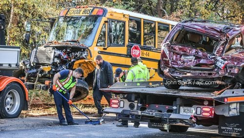 A Marietta City Schools bus and an SUV were seriously damaged in a head-on crash Thursday morning. Everyone involved, including four students, was able to walk away.