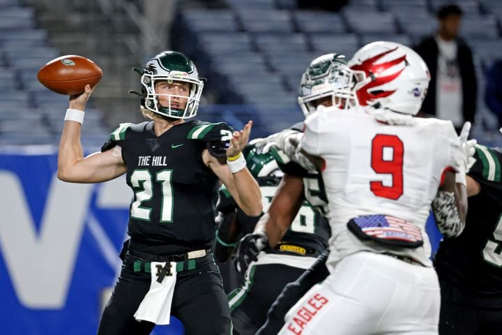 Collins Hill quarterback Sam Horn (21) attempts a pass against Milton during the first half of the Class 7A state title football game at Georgia State Center Parc Stadium Saturday, December 11, 2021, Atlanta. JASON GETZ FOR THE ATLANTA JOURNAL-CONSTITUTION