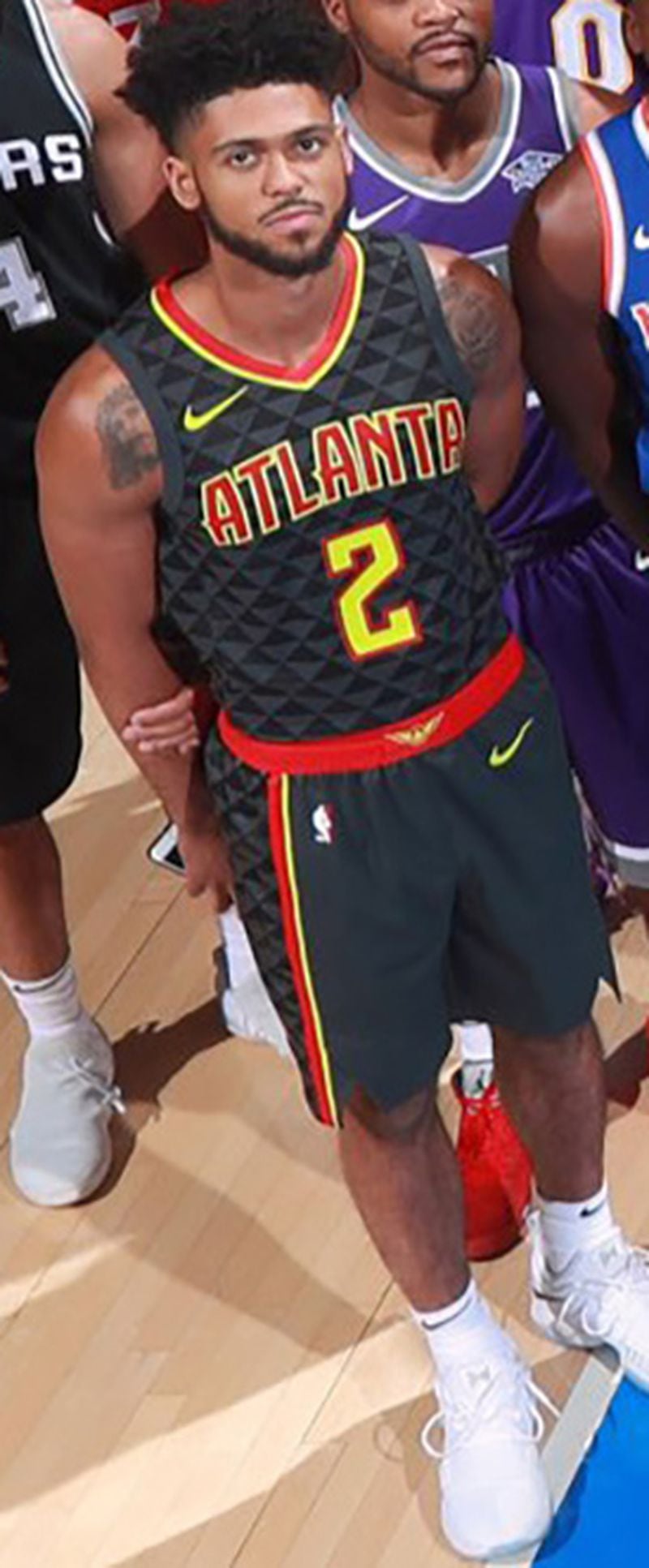 A close-up of Hawks rookie Tyler Dorsey wearing the team's new Nike uniform from the NBA rookie photo shoot Friday.