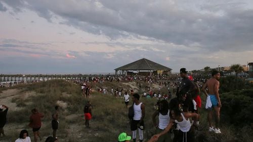 People leaving the beach in a hurry after, apparently, someone flashed their gun at another person during Orange Crush on Tybee Island, Saturday, April 22. (Photo Courtesy of RJ Smith/ Savannah Morning News)