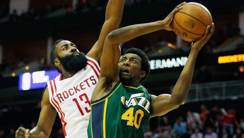James Harden (13) of the Houston Rockets defends against Jeremy Evans (40) of the Utah Jazz during their game at the Toyota Center on April 15, 2015 in Houston, Texas.  (Photo by Scott Halleran/Getty Images)