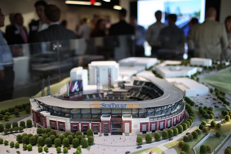 A scale model of the new Braves stadium sits on display as people gather for a meeting about future plans for transit in Cobb at the SunTrust Park Preview Center, Thursday, Oct. 20, 2016, in Atlanta. BRANDEN CAMP/SPECIAL