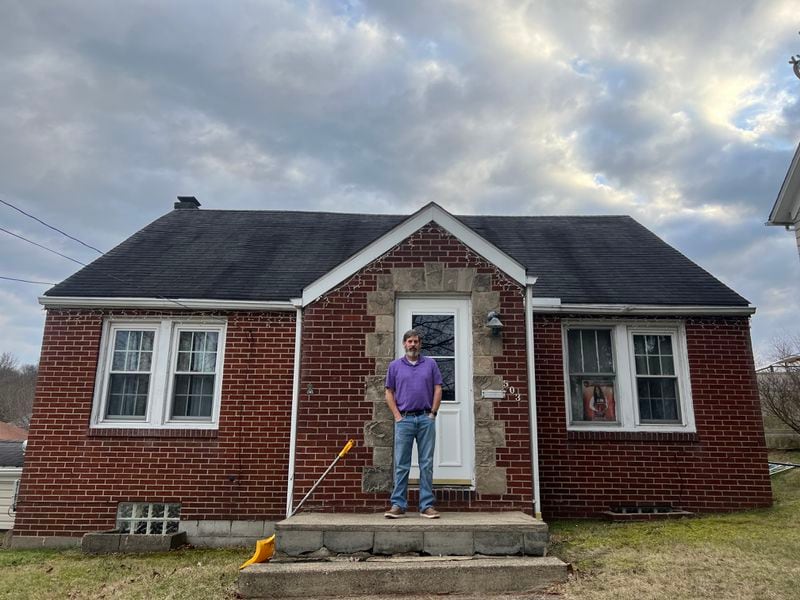 Chris Albright stands in front of his house in East Palestine, Ohio.