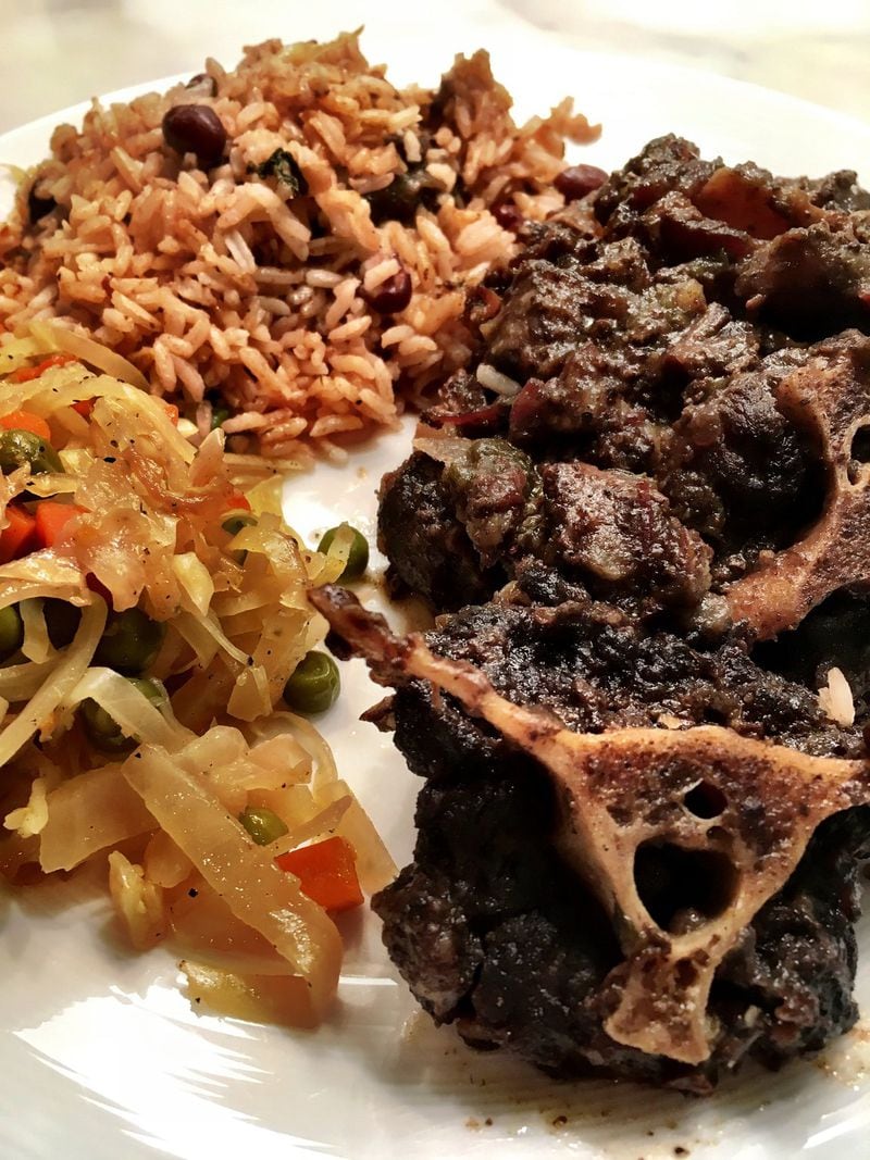 Oxtails are cooked down in a very dark brown stew at Irie Mon Cafe in Buckhead. PHOTO CREDIT: Wyatt Williams