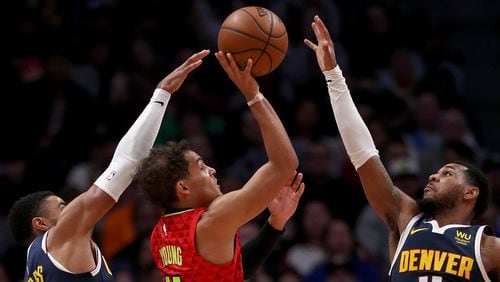 Trae Young of the Hawks puts up a shot against the Nuggets. (Photo by Matthew Stockman/Getty Images)