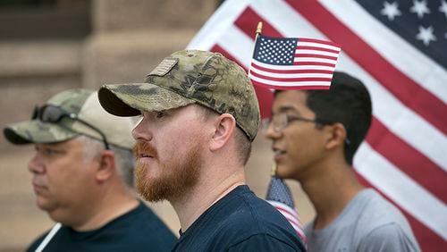 Veterans from the local area, including from left, Roberto Perez, Jr. and Chris Renfro, along with Perez's son Daniel, 16, met on the south steps of the Texas State Capitol Saturday May 20, 2017 to continue to bring awareness to the plight of the Veteran in the United States. The group was representing Veterans March On America and Victory For Veterans Foundation and their hope is to raise funds to assist other veteran organizations. The turnout was small due to inclement weather.
RALPH BARRERA/AMERICAN-STATESMAN