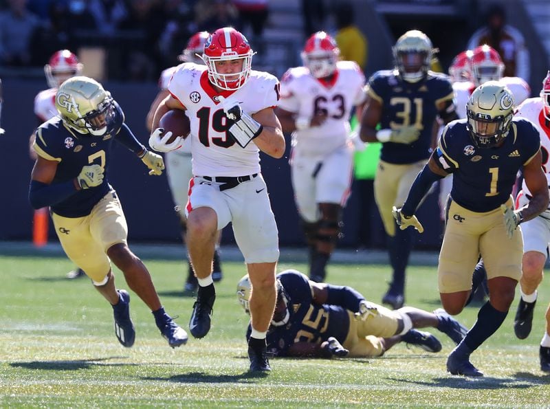 Tight end Brock Bowers breaks away from Georgia Tech defenders as he heads to the end zone on a long touchdown reception to take a 24-0 lead over Georgia Tech during the second quarter in a NCAA college football game on Saturday, Nov. 27, 2021, in Atlanta.   Curtis Compton / Curtis.Compton@ajc.com
