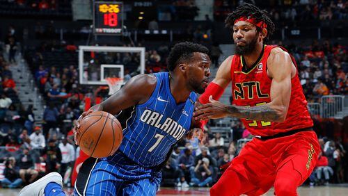 Shelvin Mack of the Orlando Magic drives against DeAndre' Bembry  of the Atlanta Hawks at Philips Arena on December 9, 2017 in Atlanta, Georgia.   (Photo by Kevin C. Cox/Getty Images)
