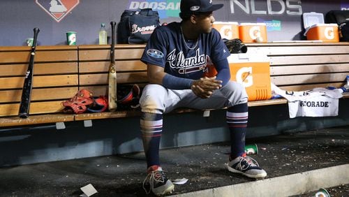 Braves’ Ronald Acuna Jr. sits in the dugout during the 9th inning of a 6-0 shutout loss to the Los Angeles Dodgers.   Curtis Compton/ccompton@ajc.com