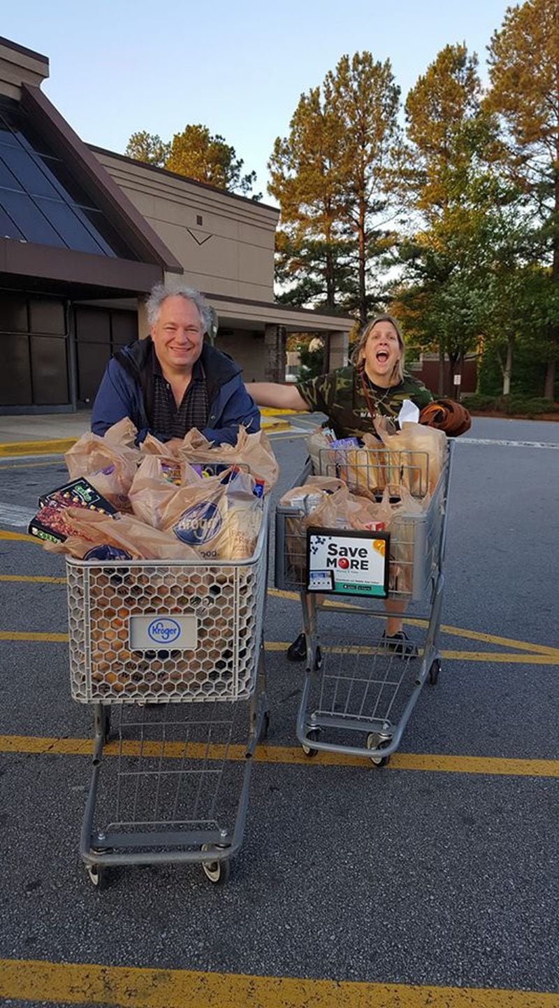 Scott and Ashleigh Jenkins, of Lilburn, purchased two carts' worth of food for under $200 at the Snellville Kroger that is closing May 9.
