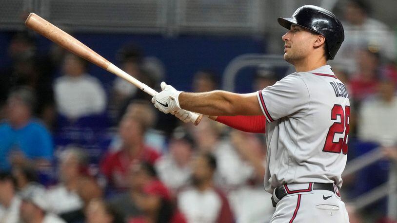 Atlanta Braves' Matt Olson watches after hitting a solo home run during the sixth inning of a baseball game against the Miami Marlins, Saturday, Sept. 16, 2023, in Miami. (AP Photo/Lynne Sladky)