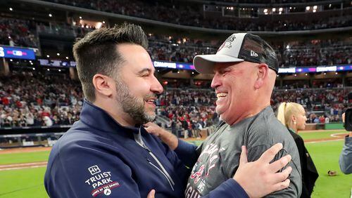 Atlanta Braves general manager Alex Anthopoulos, left, and manager Brian Snitker celebrate the Braves' 4-2 win against the Los Angeles Dodgers to advance to the World Series in Game 6 of the National League Championship Series at Truist Park, Saturday Oct. 23, 2021, in Atlanta. Curtis Compton / curtis.compton@ajc.com