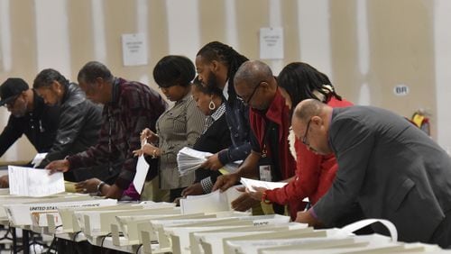 Fulton County will start driving voting cards to the Fulton County Elections Preparation Center in west Midtown instead of using a modem to upload results. HYOSUB SHIN / HSHIN@AJC.COM AJC FILE PHOTO