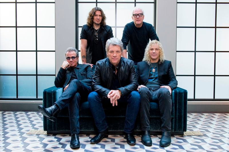 FILE - In this Oct. 19, 2016 file photo, members of Bon Jovi front row from left, Tico Torres, Jon Bon Jovi, David Bryan, back row from left, Phil X, and Hugh McDonald pose for a portrait in promotion of their album "This House is Not for Sale" in New York. Hulu is streaming a four-part docuseries "Thank You, Good Night: The Bon Jovi Story," premiering April 26. (Photo by Drew Gurian/Invision/AP, File)