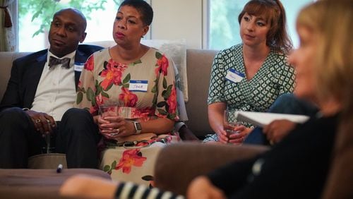 Mawuli Davis, Jana Johnson-Davis, and Monica Agoston listen as actor Jay Jones reads a short script centered on race as part of Decatur Dinners at the home of Clare and Jay Schexnyder on Sunday, Aug. 25, 2019, in Decatur. The reading and dinner was one of 100 being held simultaneously across Decatur to talk about race and equity. (Elijah Nouvelage for The Atlanta Journal-Constitution)
