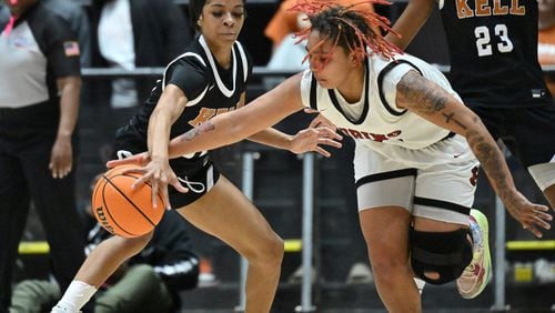 Kell’s Crystal Henderson (left) steals a basketball from Warner Robins' Jada Morgan (right) during 2023 GHSA Basketball Class 5A Girl’s State Championship game at the Macon Centreplex, Wednesday, March 8, 2023, in Macon, GA. (Hyosub Shin / Hyosub.Shin@ajc.com)
