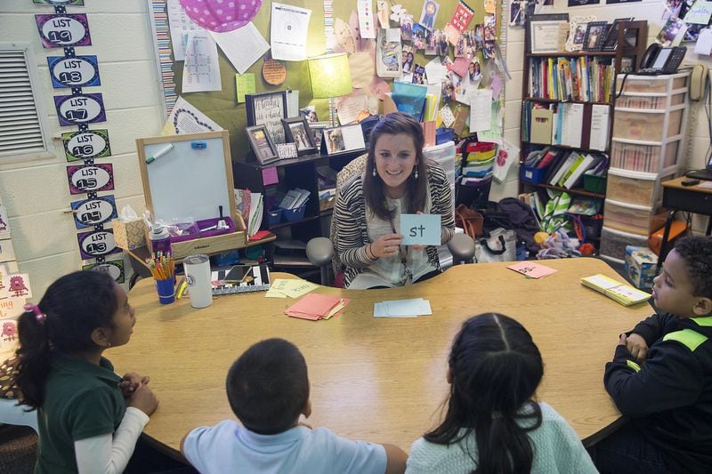 First grade teacher Jessica Strickland (center) teaches a phonics lesson to her students using the Orton Gillingham learning approach at Sawyer Road Elementary school in Marietta, Thursday, February 7, 2019. 