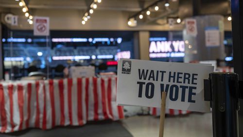 Voting signage is displayed during a tour of State Farm Arena in Atlanta, Friday, July 17, 2020. State Farm Arena, home of the Atlanta Hawks, will host early voting and the 2020 presidential election for Fulton County residents.  (ALYSSA POINTER / ALYSSA.POINTER@AJC.COM)