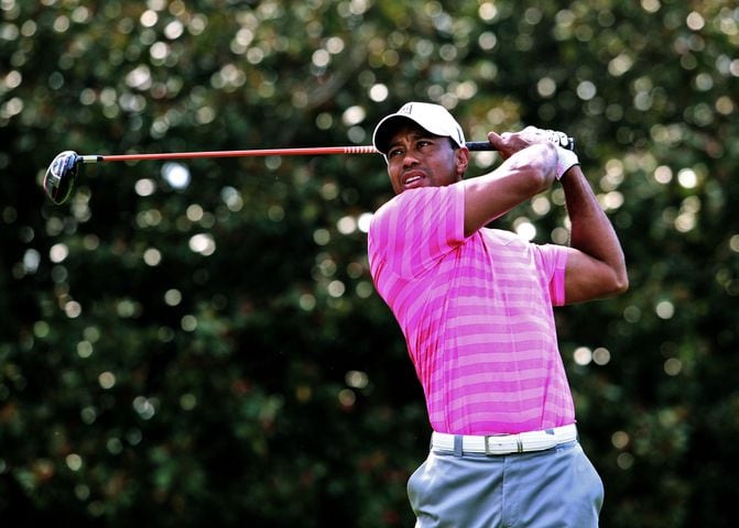 Woods, Rose start day in the lead