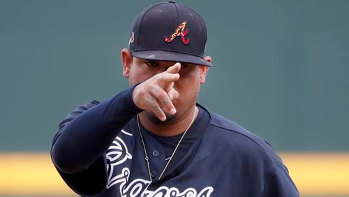 Braves pitcher Felix Hernandez signals to his catcher as he warms up for a spring exhibition game against the Tampa Bay Rays, Tuesday, March 3, 2020, in Venice, Fla.