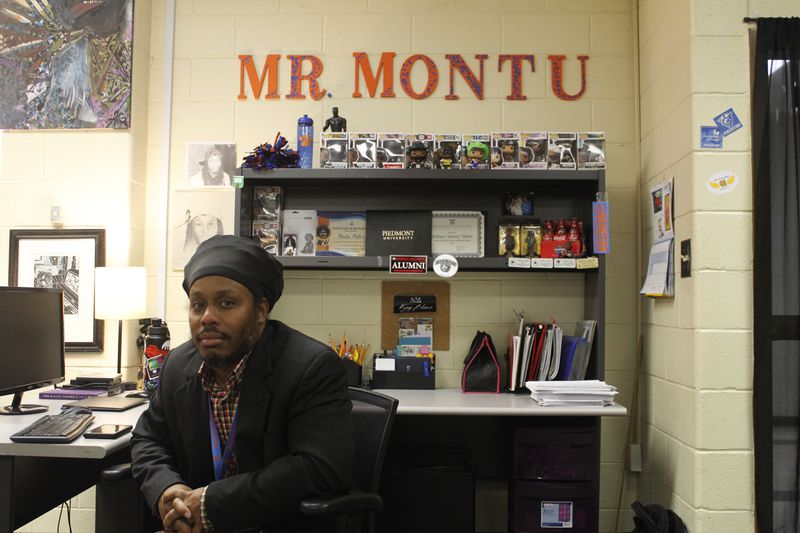 Montu Miller, a high school teacher and hip-hop advocate, poses in his classroom at Cedar Shoals High School in Athens, Georgia, on Monday, Oct. 23, 2023. Miller teaches AP African American Studies and supports local hip-hop artists with his company, AthFactor-Liberty Entertainment. (Photo Courtesy of Lilly Kersh)