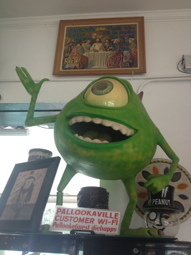 Mike Wazowski of "Monsters Inc." greets customers at Pallookaville Fine Foods in Avondale Estates. CREDIT: Rodney Ho/rho@ajc.com
