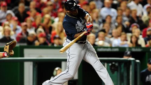 Sep 18, 2013; Washington, DC, USA; Atlanta Braves outfielder Justin Upton (8) singles in the fourth inning against the Washington Nationals at Nationals Park. Mandatory Credit: Evan Habeeb-USA TODAY Sports
