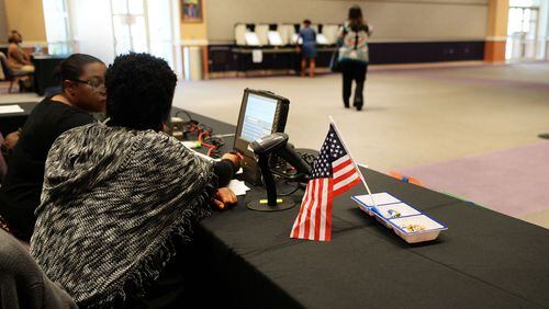 MARCH 21, 2017 STONECREST Pollworkers watch as voters select a Mayor and City Council March 21, 2017, at the New Birth Missionary Baptist Church polling location during Tuesday's election. New cities in southern DeKalb County as well as South Fulton selected their choices of leadership Tuesday. KENT D. JOHNSON/AJC