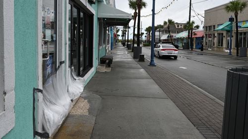 September 30, 2022 Tybee Island - Stores were boarded up and sand bagged in Tybee Island as high surf and heavy winds from Hurricane Ian impacted the area on Friday, September 30, 2022. (Hyosub Shin / Hyosub.Shin@ajc.com)