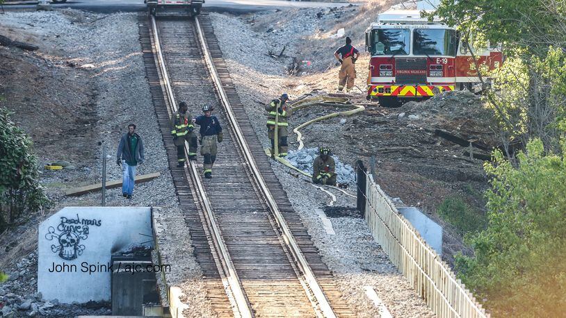 Crews extinguished a fire under a train trestle off Cheshire Bridge Road and Wellbourne Drive.