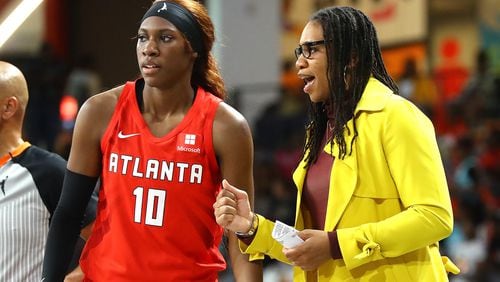 Rhyne Howard (left) and coach Tanisha Wright had strong first seasons with the Dream. The Dream signed Wright and general manager Dan Padover to five-year contract extensions. (File photo)