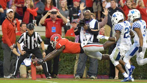 November 18, 2017 Athens - Georgia running back Sony Michel (1) dives into the endzone for a touchdown in the first half of a NCAA college football game in Athens on Saturday, November 18, 2017. HYOSUB SHIN / HSHIN@AJC.COM