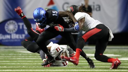 Georgia State receiver Todd Boyd (15) carries the ball against Ball State defenders Josh Miller (11) and Aaron Taylor (7) during the third quarter of their game at the Georgia Dome, Friday, September, 2016, in Atlanta, Ga. PHOTO / JASON GETZ