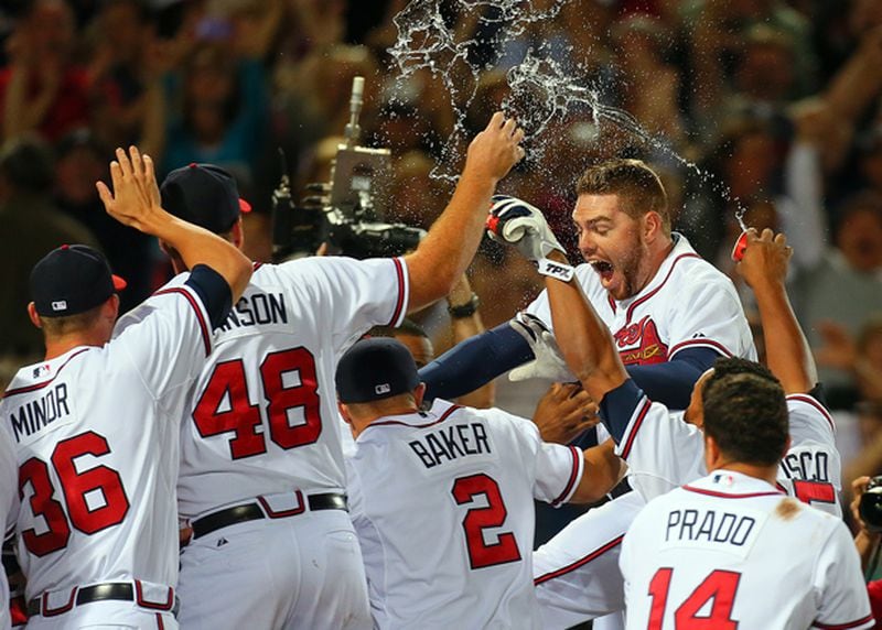Freeman's home run clinched a wild-card berth for Braves in 2012. No one else in the picture remains with the team. (Curtis Compton/AJC photo)