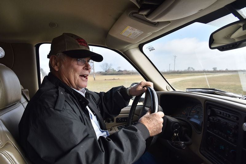 Rex Bullock, who owns about 1,000 acres of land in Wilcox County, hopes that new tariffs on China will spark the American economy. And he says that government programs have become too onerous. "We have too many regulations. There are too many people telling you how to do it." HYOSUB SHIN / HSHIN@AJC.COM