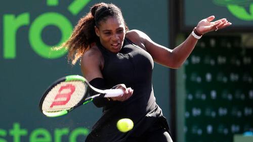 Serena Williams returns to Naomi Osaka of Japan, during the Miami Open tennis tournament, Wednesday, March 21, 2018, in Key Biscayne, Fla. (AP Photo/Lynne Sladky)