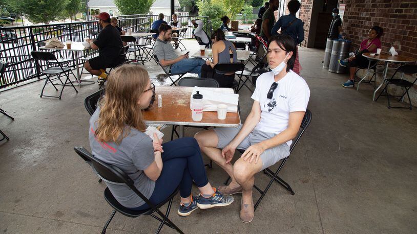 Lara Hulbert (left) and Sean McTagne eat brunch on the patio of Krog Street Market. The latest pandemic relief bill includes several items that will benefit restaurants. Steve Schaefer for The Atlanta Journal-Constitution